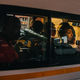 South African Commuters through the window of a taxi leaving Noord Taxi Rank at the end of the day. Johannesburg.